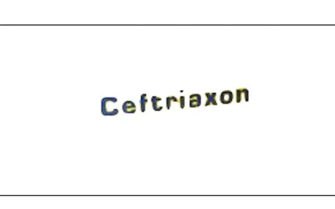 Napis "Ceftriaxon" w kolorze niebiesko-żółtym, lek stosowany w leczeniu infekcji.