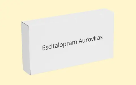 Białe pudełko leku Escitalopram Aurovitas, który pomaga w leczeniu depresji i zaburzeń lękowych.