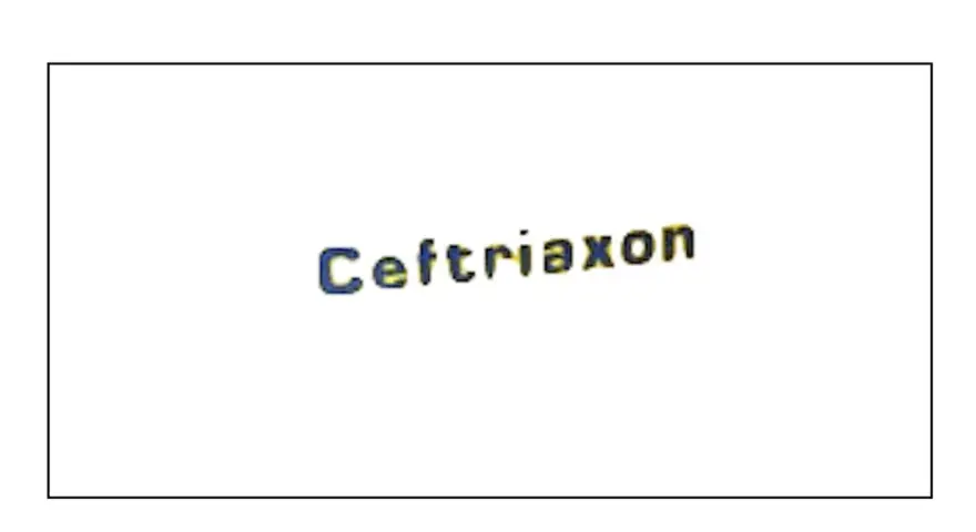 Napis "Ceftriaxon" w kolorze niebiesko-żółtym, lek stosowany w leczeniu infekcji.